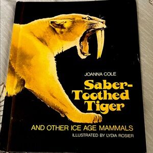 Saber-Toothed Tiger Book by Joanna Cole
Illustrated by Lydia Rosier used book